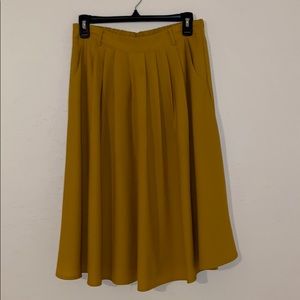 YELLOW PLEATED A-LINE MIDI SKIRT WITH POCKETS
